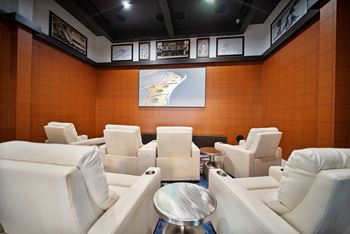 a meeting room with white chairs and a table at Altis Grand Central, Florida, 33606